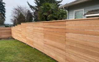 Horizontal style privacy fence with stepped grade