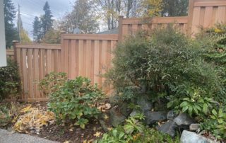 Shadow box wood fence with stepped grade