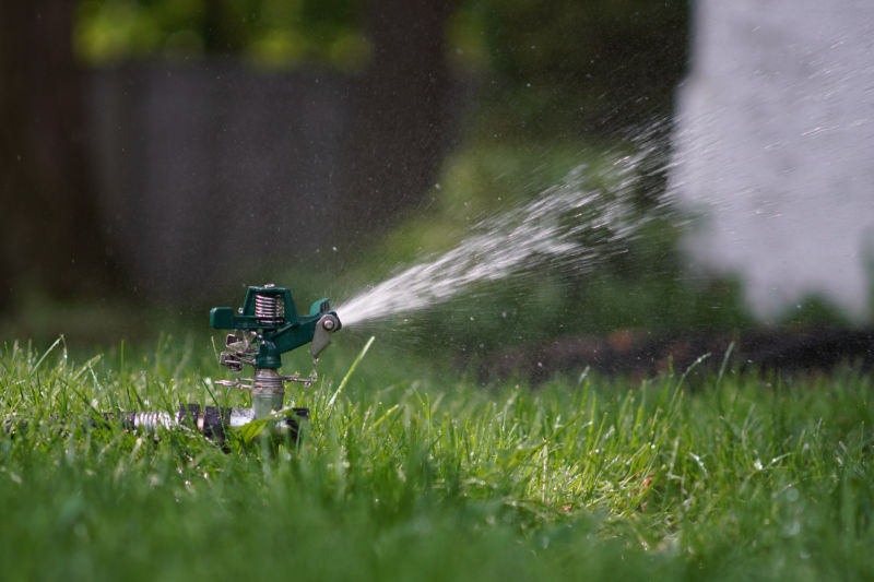 Close up of sprinkler watering a lawn