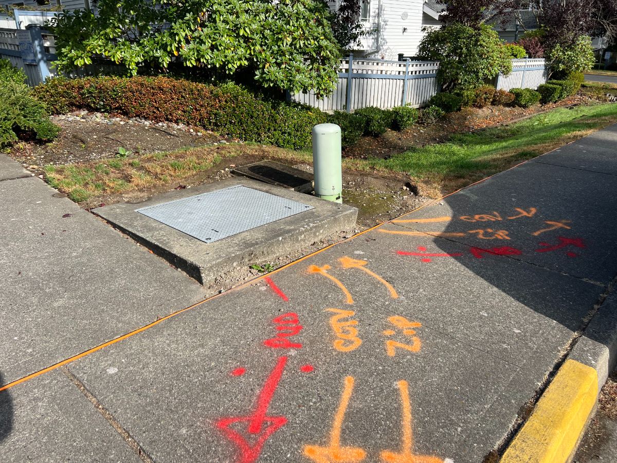 Utility easement markings on sidewalk